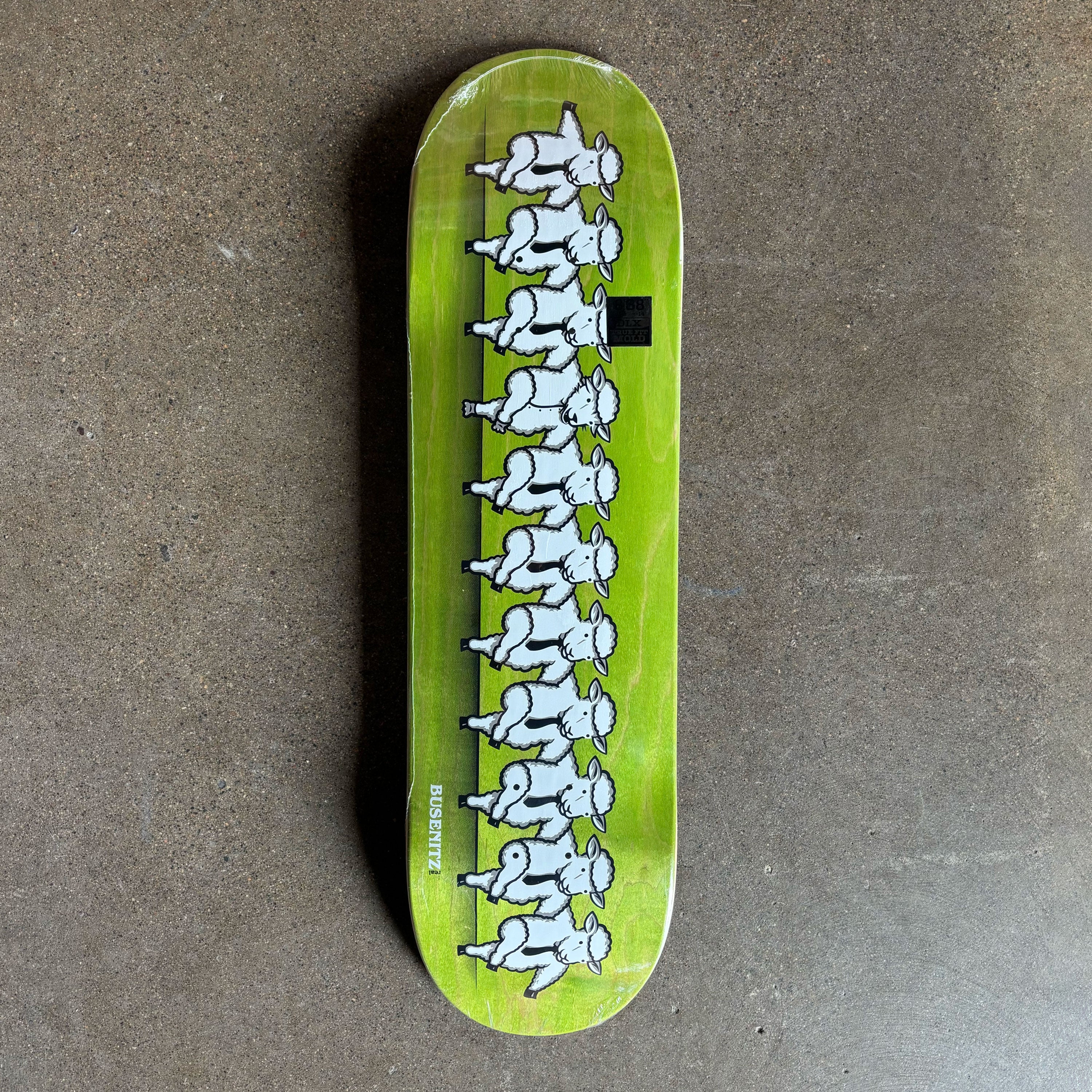 Full image of green deck with cartoon sheep.